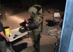 Pueblo Bomb Squad investigates suspicious device at scrap yard.