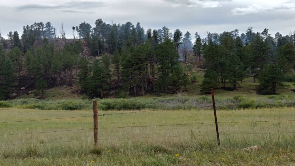 The Rainbow Fire, burning 10 miles north of Woodland Park, continues to smolder on Aug. 30, 2018, more than three weeks after it ignited.