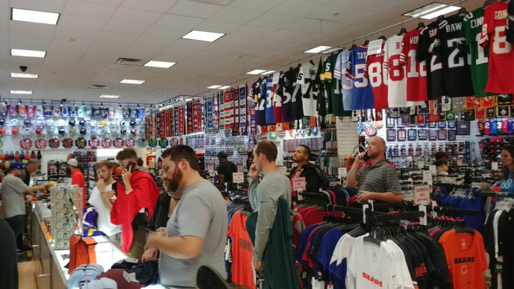 Shoppers check out Nike gear inside Prime Time Sports after the store owner announced a 50 percent-off sale on the gear following Nike's ad campaign with former NFL quarterback Colin Kaepernick.