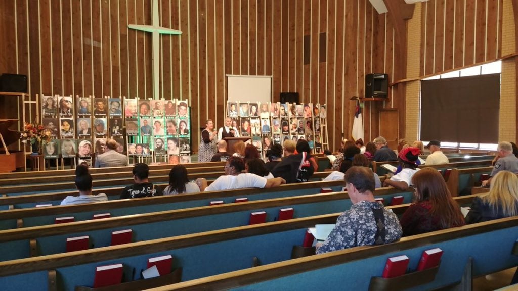 Families and friends of murder victims attend a National Day of Remembrance event at Life Church in Colorado Springs on Sept. 25, 2018. The event was organized by Mothers of Murdered Youth (MOMY), which helps the families of murder victims.