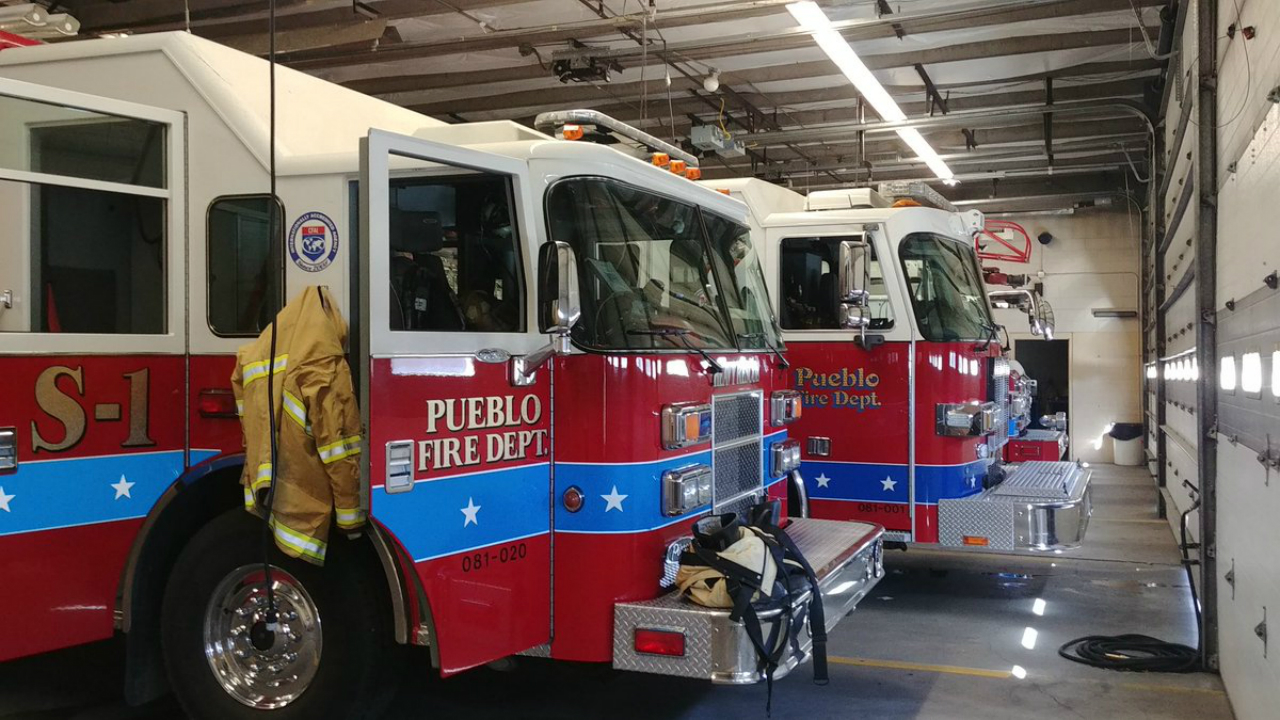 Engines sit inside Pueblo Fire Station 1.