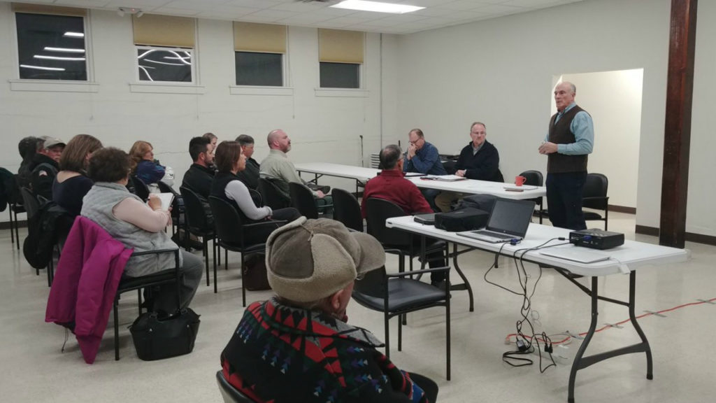 CenturyLink employees meet with Wetmore area customers on Nov. 15, 2018. The customers have been without phone service for four months following a flash flood on the Junkins burn scar on July 15.