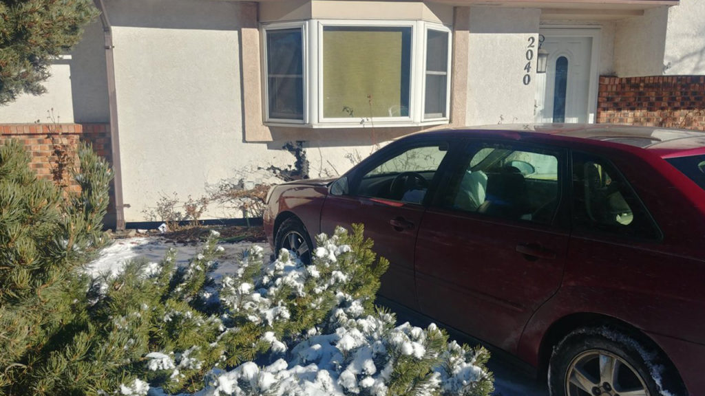 Car hits house